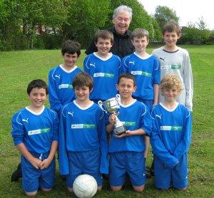 Fr Courell and Football team